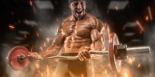 Intense athlete doing an arm curl workout routine Intense athlete doing an arm curl workout routine